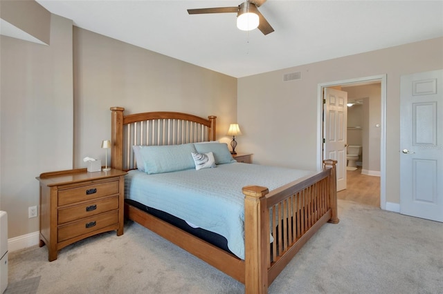 bedroom with light colored carpet, baseboards, a ceiling fan, and visible vents