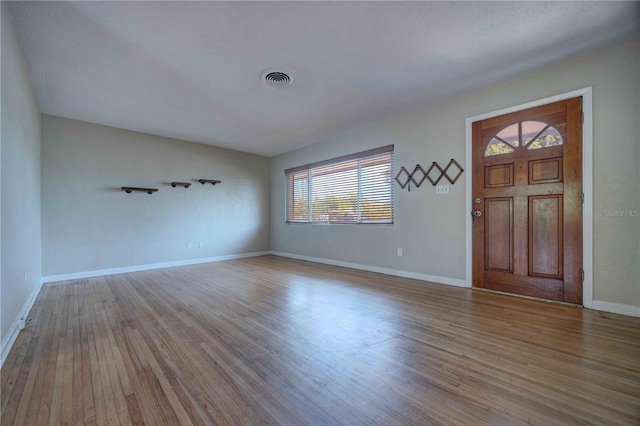 entrance foyer featuring plenty of natural light, wood finished floors, and baseboards