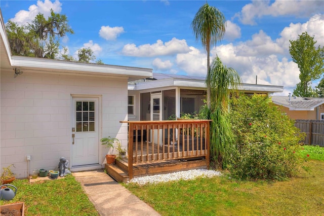 doorway to property featuring concrete block siding