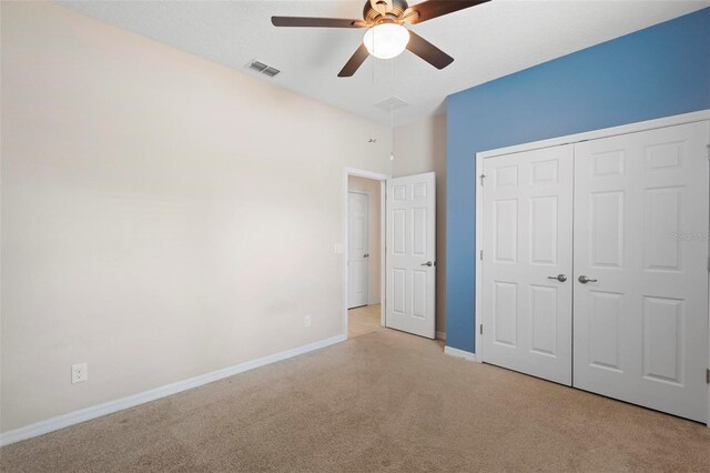 1480 Leitrim Loop, Apopka, FL 32703 - unfurnished bedroom featuring a ceiling fan, a closet, baseboards, visible vents, and light carpet