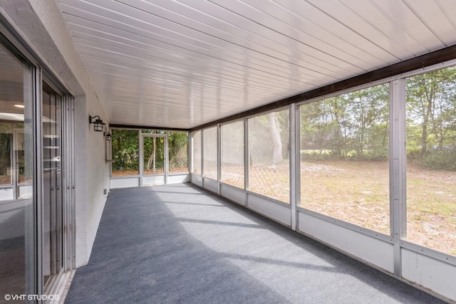 unfurnished sunroom with plenty of natural light
