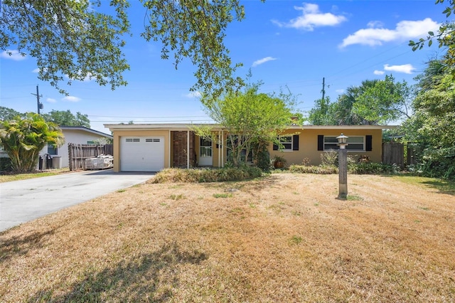 ranch-style house with driveway and an attached garage