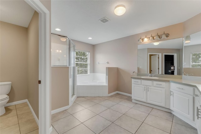 full bath with healthy amount of natural light, tile patterned floors, toilet, a bath, and recessed lighting