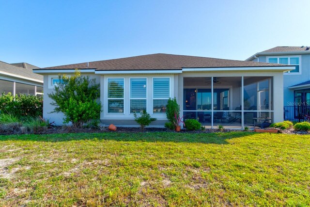 133 Azure Mist Way, Daytona Beach, FL 32124 - back of property with a sunroom and a yard
