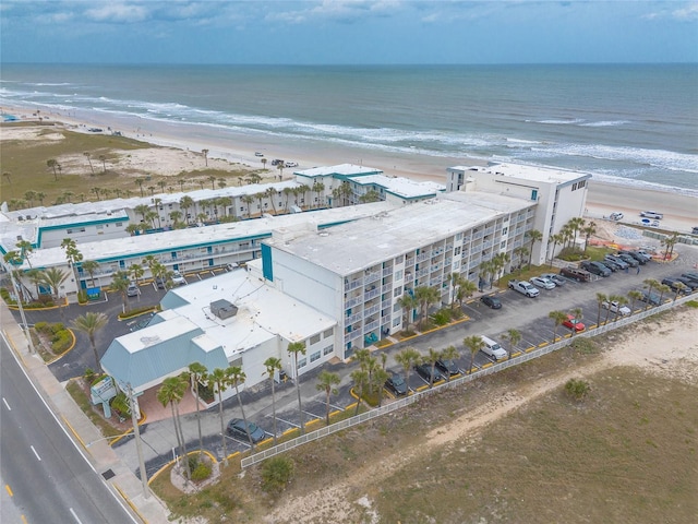 drone / aerial view of expansive beach and apartment complex / building