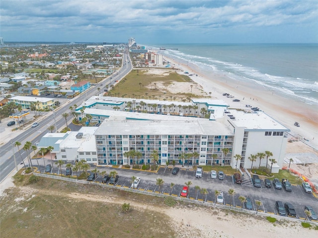 drone / aerial view of expansive beach and apartment complex