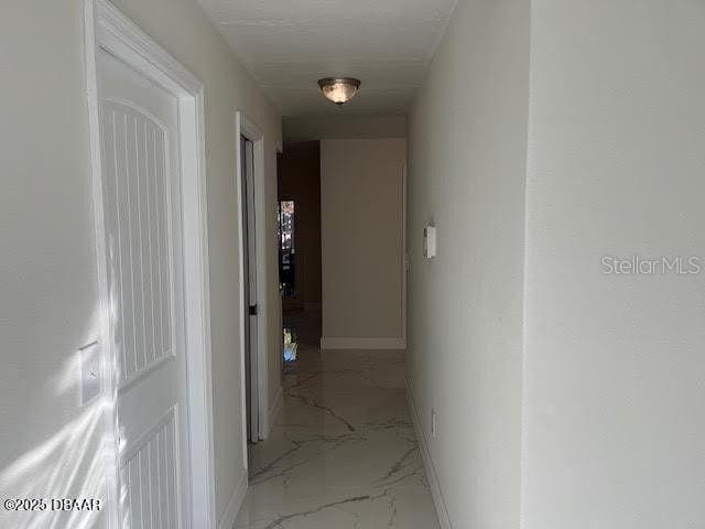 908 Boulder Dr, South Daytona, FL 32119 - corridor with marble finish floors and baseboards