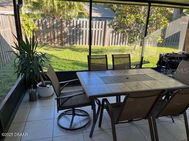 908 Boulder Dr, South Daytona, FL 32119 - sunroom featuring outdoor dining space