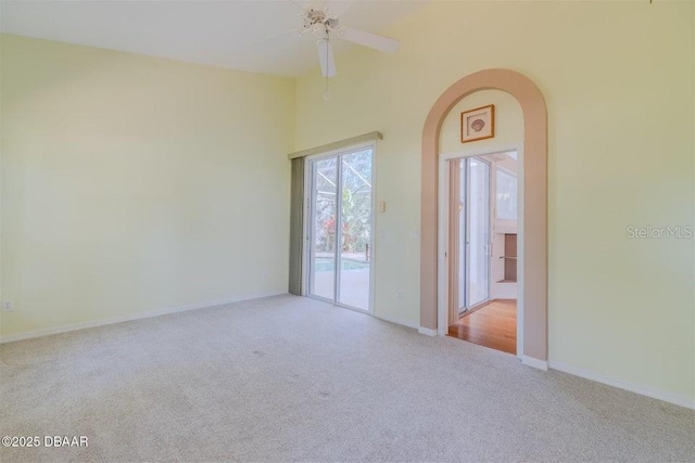 3601 Galway Ln, Ormond Beach, FL 32174 - carpeted empty room with ceiling fan, baseboards, and arched walkways