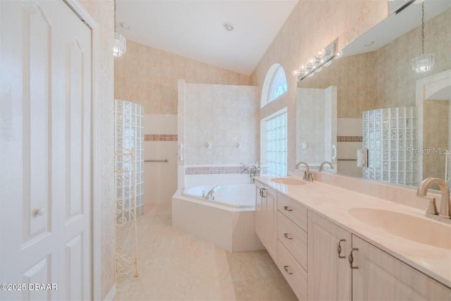 3601 Galway Ln, Ormond Beach, FL 32174 - full bathroom featuring a garden tub, double vanity, lofted ceiling, tile patterned flooring, and walk in shower