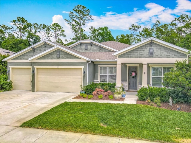 409 Nowell Loop, Deland, FL 32724 - craftsman-style home featuring a front yard, an attached garage, stucco siding, concrete driveway, and a shingled roof