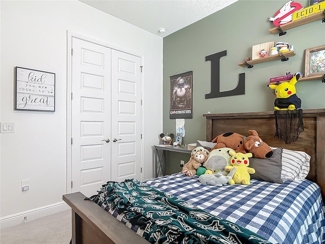 409 Nowell Loop, Deland, FL 32724 - bedroom featuring a closet, carpet floors, and baseboards