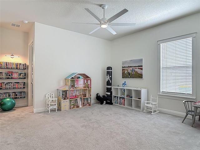 409 Nowell Loop, Deland, FL 32724 - game room featuring ceiling fan, carpet, baseboards, and a textured ceiling