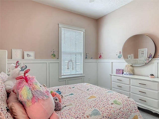 409 Nowell Loop, Deland, FL 32724 - bedroom with a decorative wall and a wainscoted wall