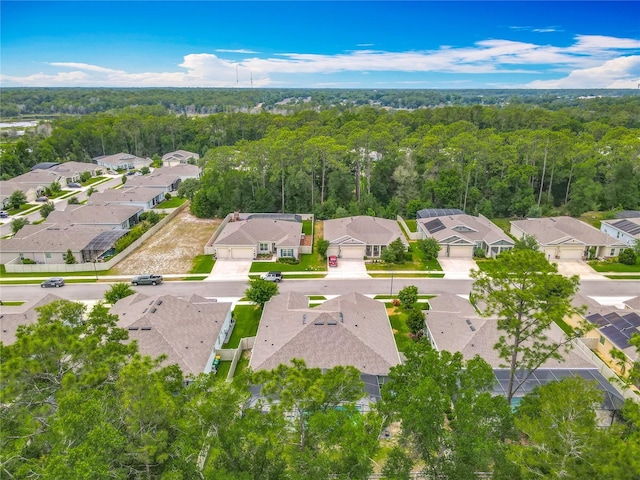 409 Nowell Loop, Deland, FL 32724 - aerial perspective of suburban area featuring a heavily wooded area