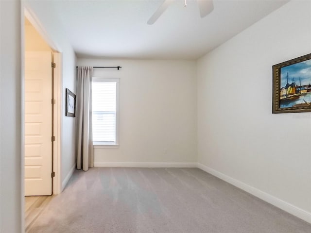 409 Nowell Loop, Deland, FL 32724 - empty room featuring a ceiling fan, carpet floors, and baseboards