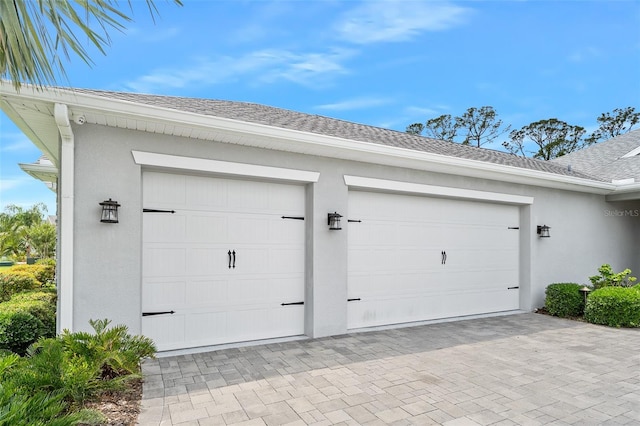 3322 Modena Way, New Smyrna Beach, FL 32168 - garage featuring decorative driveway