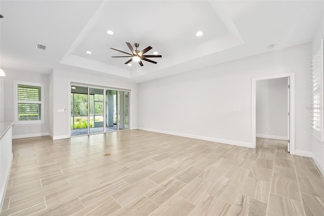 3322 Modena Way, New Smyrna Beach, FL 32168 - unfurnished room with a raised ceiling, a ceiling fan, baseboards, and recessed lighting