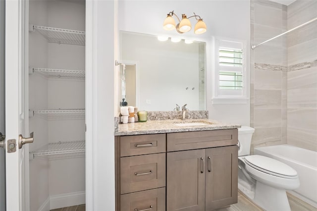 3322 Modena Way, New Smyrna Beach, FL 32168 - full bathroom with toilet, vanity, washtub / shower combination, and a spacious closet