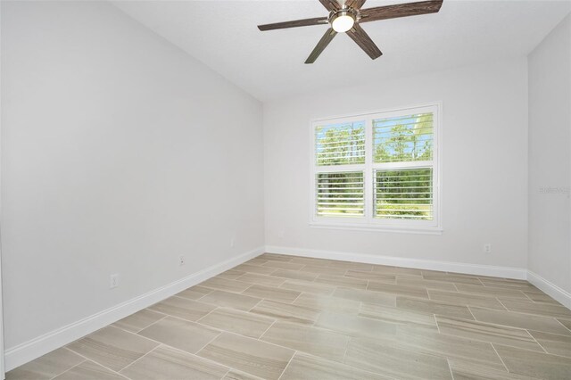 3322 Modena Way, New Smyrna Beach, FL 32168 - empty room with ceiling fan, baseboards, and vaulted ceiling