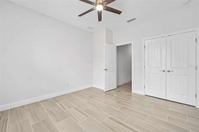 3322 Modena Way, New Smyrna Beach, FL 32168 - unfurnished bedroom with baseboards, a closet, ceiling fan, and light wood-style flooring