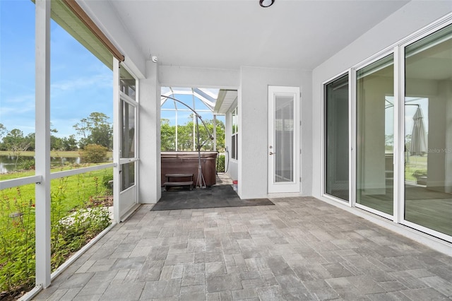 3322 Modena Way, New Smyrna Beach, FL 32168 - unfurnished sunroom with a hot tub and a water view