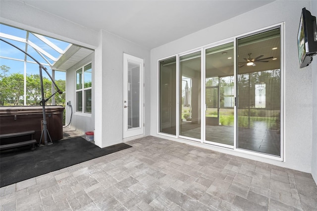 3322 Modena Way, New Smyrna Beach, FL 32168 - sunroom with a jacuzzi and ceiling fan