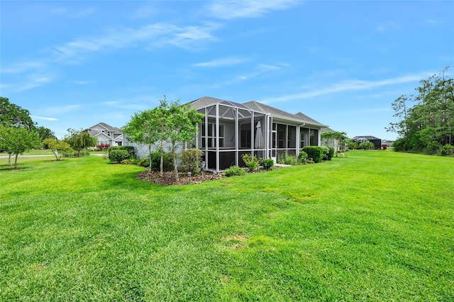 3322 Modena Way, New Smyrna Beach, FL 32168 - view of grassy yard featuring glass enclosure