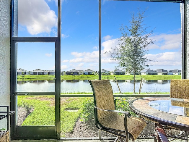 14204 Heritage Landing Blvd Unit 714, Punta Gorda, FL 33955 - sunroom / solarium featuring a water view and a residential view