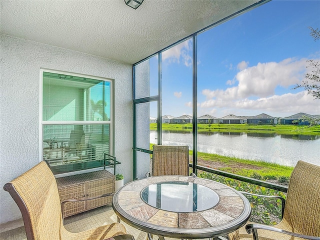 14204 Heritage Landing Blvd Unit 714, Punta Gorda, FL 33955 - sunroom / solarium featuring a water view