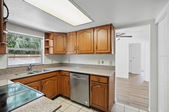 1209 James Ter, Daytona Beach, FL 32117 - kitchen featuring stainless steel dishwasher, a sink, open shelves, and electric range