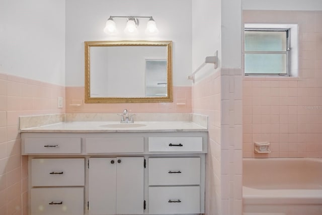 1209 James Ter, Daytona Beach, FL 32117 - full bathroom with tile walls, vanity, wainscoting, and tub / shower combination