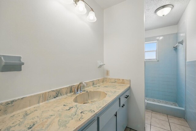 1209 James Ter, Daytona Beach, FL 32117 - bathroom featuring a stall shower, vanity, and tile patterned flooring