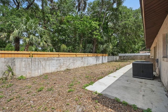 1209 James Ter, Daytona Beach, FL 32117 - fenced backyard featuring cooling unit and a patio area