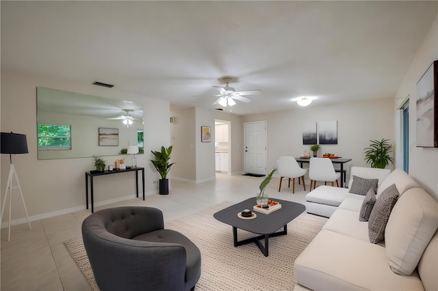 818 Sugar House Blvd, Port Orange, FL 32129 - living area with ceiling fan, light tile patterned flooring, and baseboards