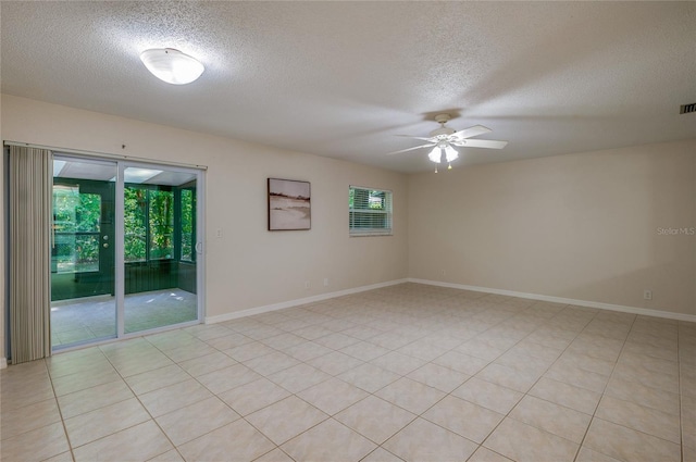 818 Sugar House Blvd, Port Orange, FL 32129 - unfurnished room featuring a textured ceiling, a ceiling fan, and baseboards