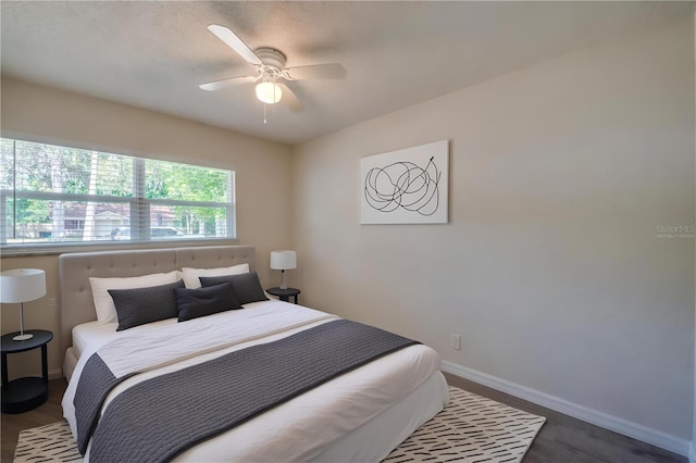 818 Sugar House Blvd, Port Orange, FL 32129 - bedroom featuring wood finished floors, baseboards, and a ceiling fan