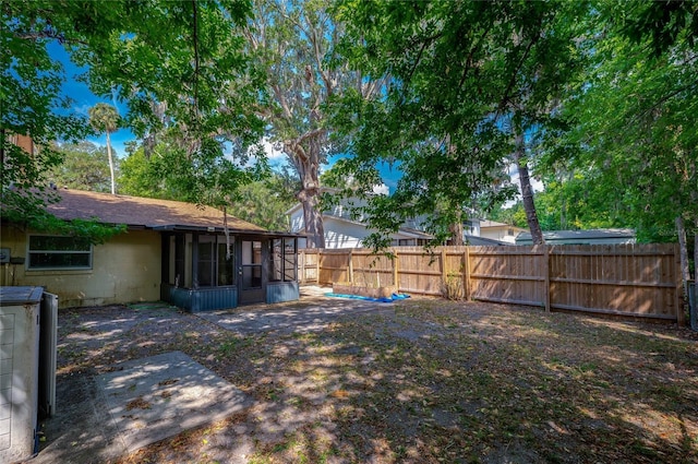 818 Sugar House Blvd, Port Orange, FL 32129 - fenced backyard featuring a sunroom