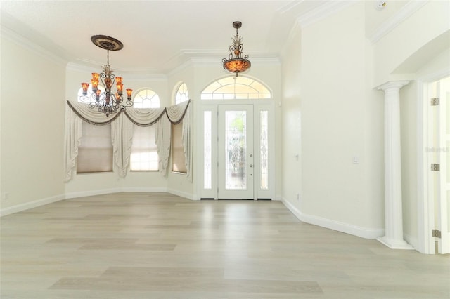 340 Hampton Hills Ct, Debary, FL 32713 - entryway with a chandelier, light wood-style floors, crown molding, ornate columns, and baseboards