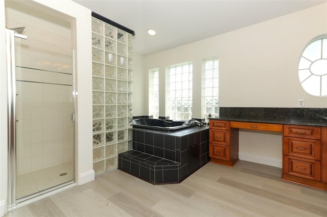 340 Hampton Hills Ct, Debary, FL 32713 - bathroom with wood finished floors, a shower stall, vanity, and recessed lighting