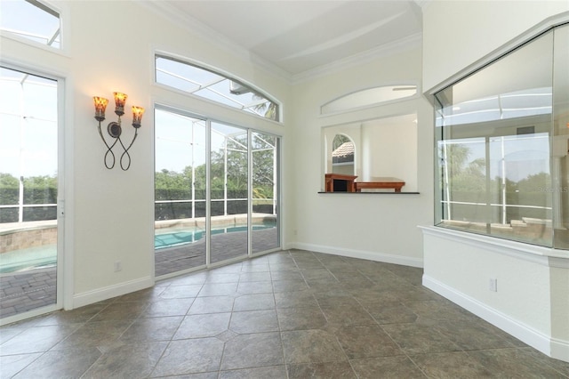 340 Hampton Hills Ct, Debary, FL 32713 - unfurnished room with crown molding, baseboards, and stone finish floors