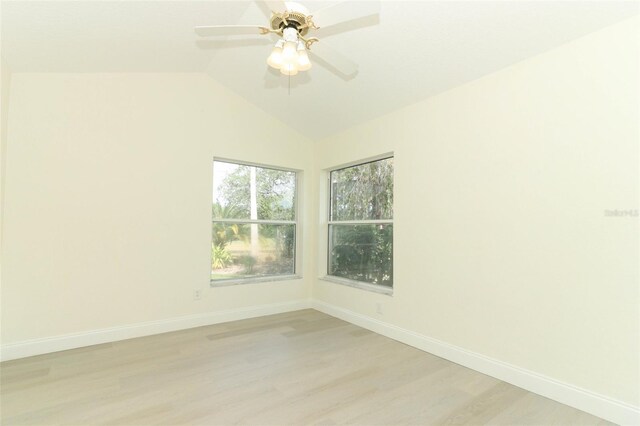 340 Hampton Hills Ct, Debary, FL 32713 - spare room featuring light wood-type flooring, baseboards, vaulted ceiling, and a ceiling fan