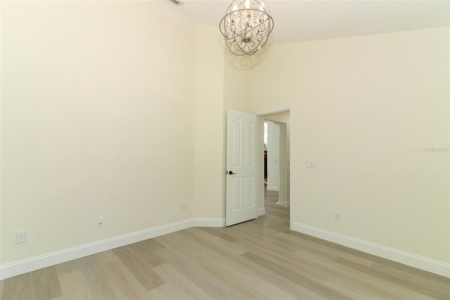 340 Hampton Hills Ct, Debary, FL 32713 - unfurnished room with a chandelier, light wood-type flooring, and baseboards