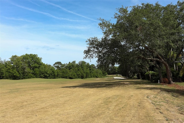 340 Hampton Hills Ct, Debary, FL 32713 - view of green lawn with view of scattered trees and golf course view