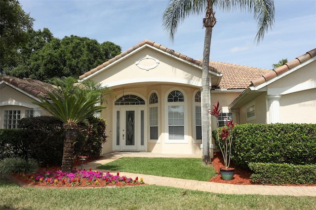340 Hampton Hills Ct, Debary, FL 32713 - entrance to property with stucco siding and a tile roof
