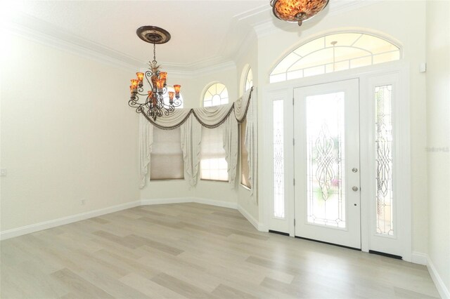 340 Hampton Hills Ct, Debary, FL 32713 - entryway featuring a chandelier, crown molding, and wood finished floors