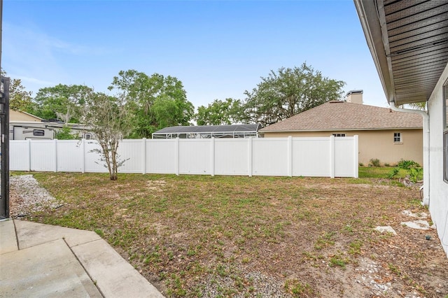 view of yard with fence and a patio area