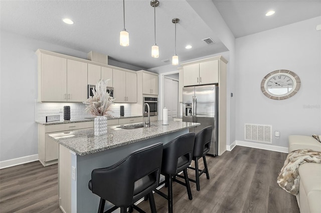 165 Azure Mist Way, Daytona Beach, FL 32124 - kitchen featuring stainless steel appliances, a sink, baseboards, a kitchen breakfast bar, and light stone counters
