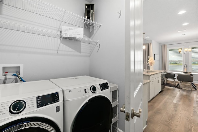165 Azure Mist Way, Daytona Beach, FL 32124 - laundry area featuring washing machine and dryer, light wood-type flooring, a chandelier, and recessed lighting
