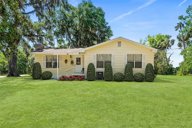 51 Silk Moss Ct, South Daytona, FL 32119 - ranch-style home featuring a front lawn, cooling unit, and a chimney